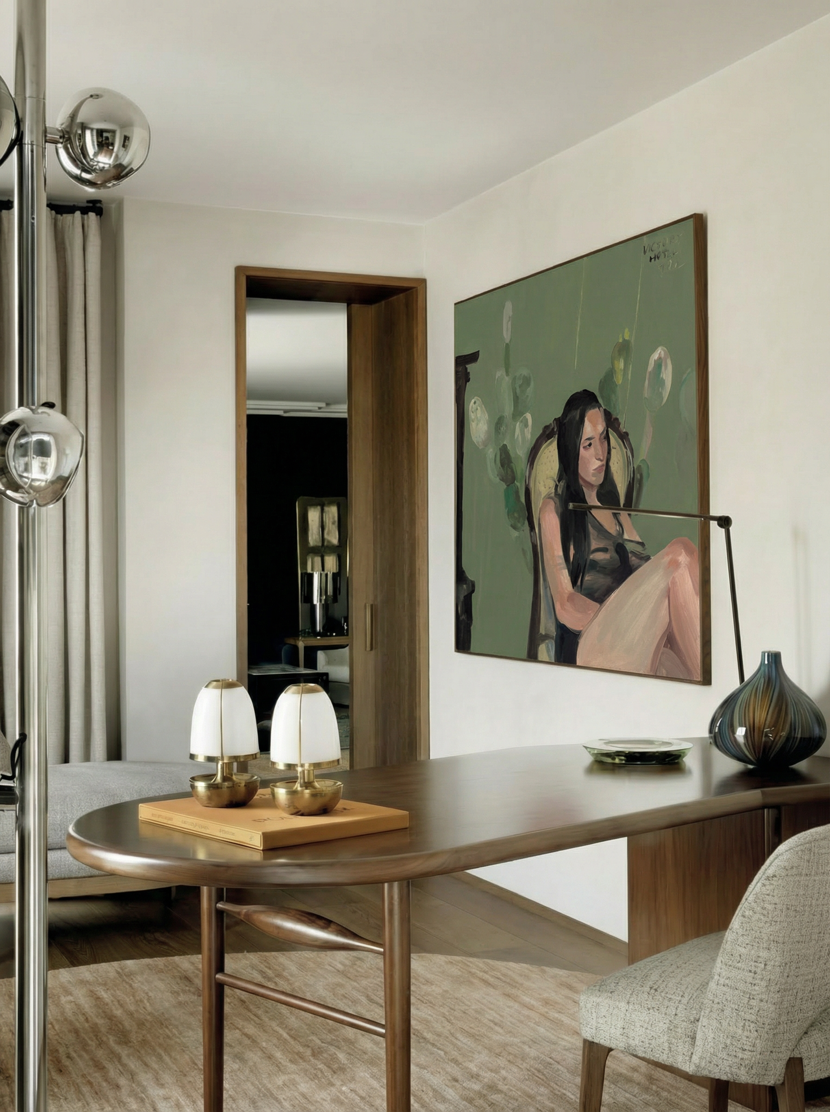 Modern interior with a painting of a woman on a wall, a table with decorative items, and a chair. Bangkok girl– Figurative Canvas Wall Art | Contemporary Luxury Print | Brume Art| Luxury Wall Decor | Large Canvas Wall Art | Oversized Wall Hanging-Brume art