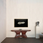 Modern interior with a wooden console table, abstract sculpture, and framed artwork on a white wall. Pearl 2 – Elegant Abstract Canvas Wall Art | Luxury Giclée Print | Brume Art| Luxury Wall Decor | Large Canvas Wall Art | Oversized Wall Hanging-Brume art