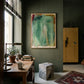 Modern interior with a painting on the wall, wooden table, and chair. Abstract painting with green and brown tones on a white background Field green 2 – Abstract Canvas Wall Art | Large Luxury Print | Brume Art