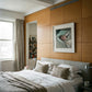 Modern bedroom with wooden paneling, bed, and framed picture on wall. Gaze – Figurative Canvas Wall Art | Premium Luxury Print | Brume Art | Luxury Wall Decor | Large Canvas Wall Art | Oversized Wall Hanging-Brume art