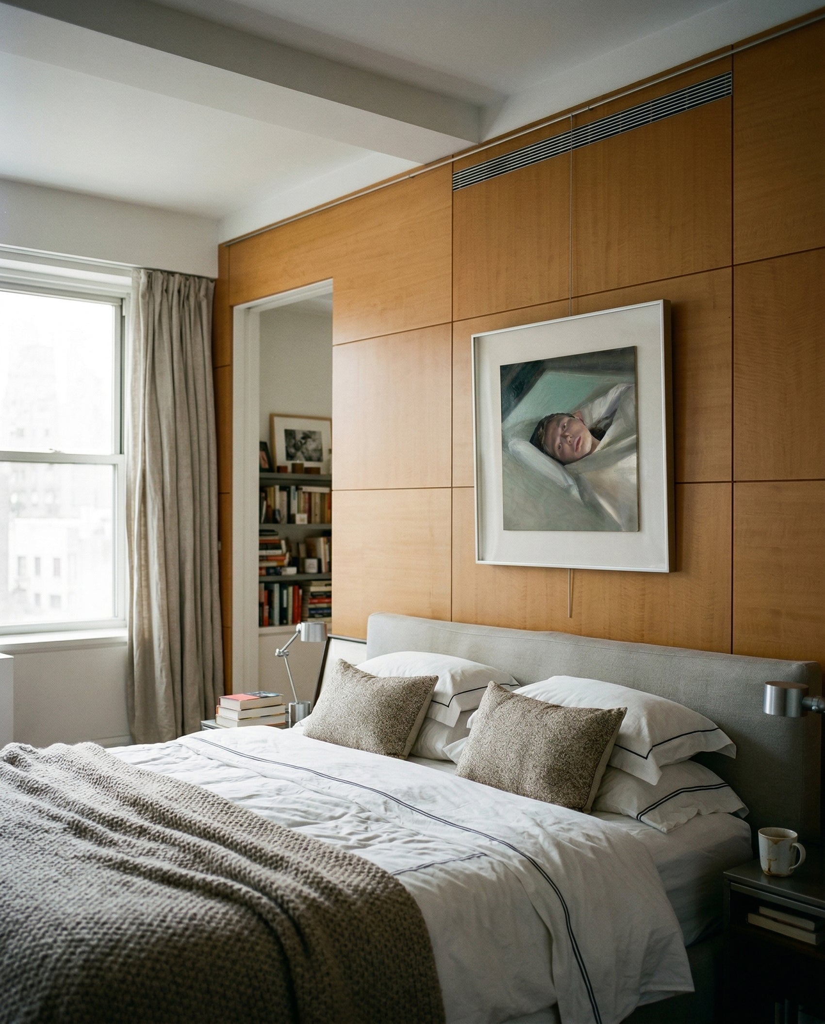 Modern bedroom with wooden paneling, bed, and framed picture on wall. Gaze – Figurative Canvas Wall Art | Premium Luxury Print | Brume Art | Luxury Wall Decor | Large Canvas Wall Art | Oversized Wall Hanging-Brume art