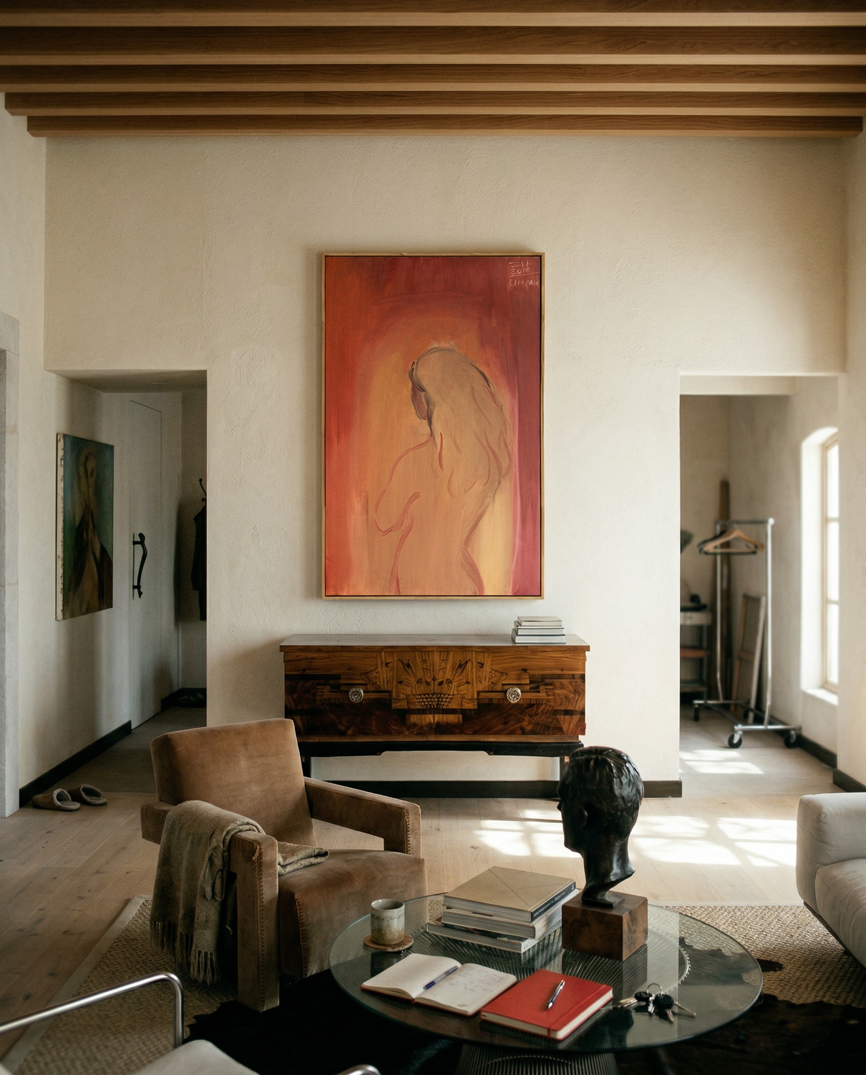 Living room with a large painting on the wall, wooden console table, and round glass coffee table. Presence – Contemporary Figurative Canvas Print | Luxury Wall Art | Brume Art