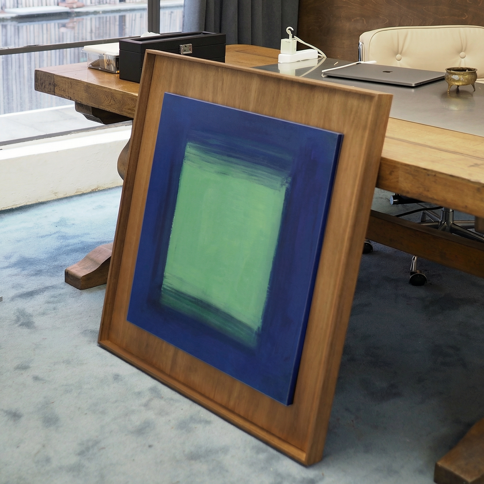 Framed abstract artwork with blue and green colors in a modern office setting. Frame 2 - Bold Abstract Canvas Print | Large Luxury Wall Art | Brume Art| Luxury Wall Decor | Large Canvas Wall Art | Oversized Wall Hanging-Brume art