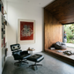 Modern interior with a black Eames lounge chair, ottoman, and a large abstract painting on the wall. Tension – Bold Abstract Canvas Print | Large Luxury Wall Art | Brume Art