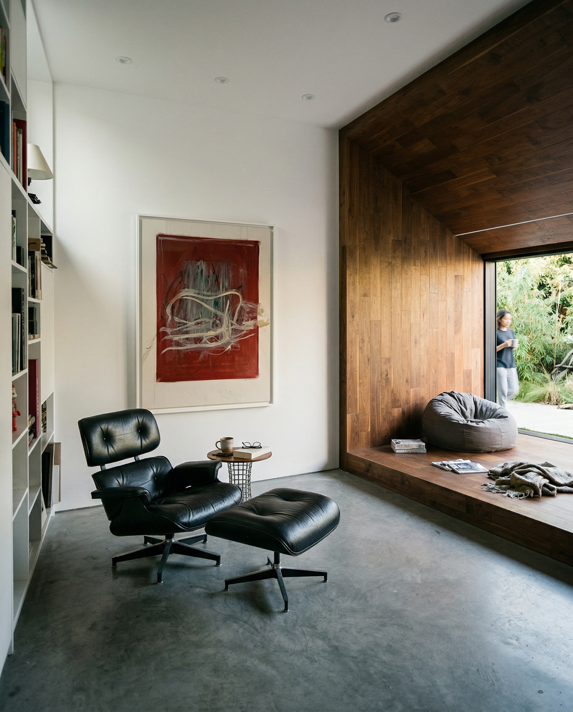 Modern interior with a black Eames lounge chair, ottoman, and a large abstract painting on the wall. Tension – Bold Abstract Canvas Print | Large Luxury Wall Art | Brume Art