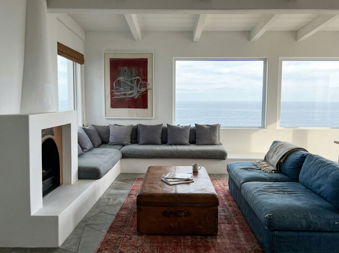 Modern living room with gray sectional sofa, blue sofa, and wooden coffee table. Tension – Bold Abstract Canvas Print | Large Luxury Wall Art | Brume Art