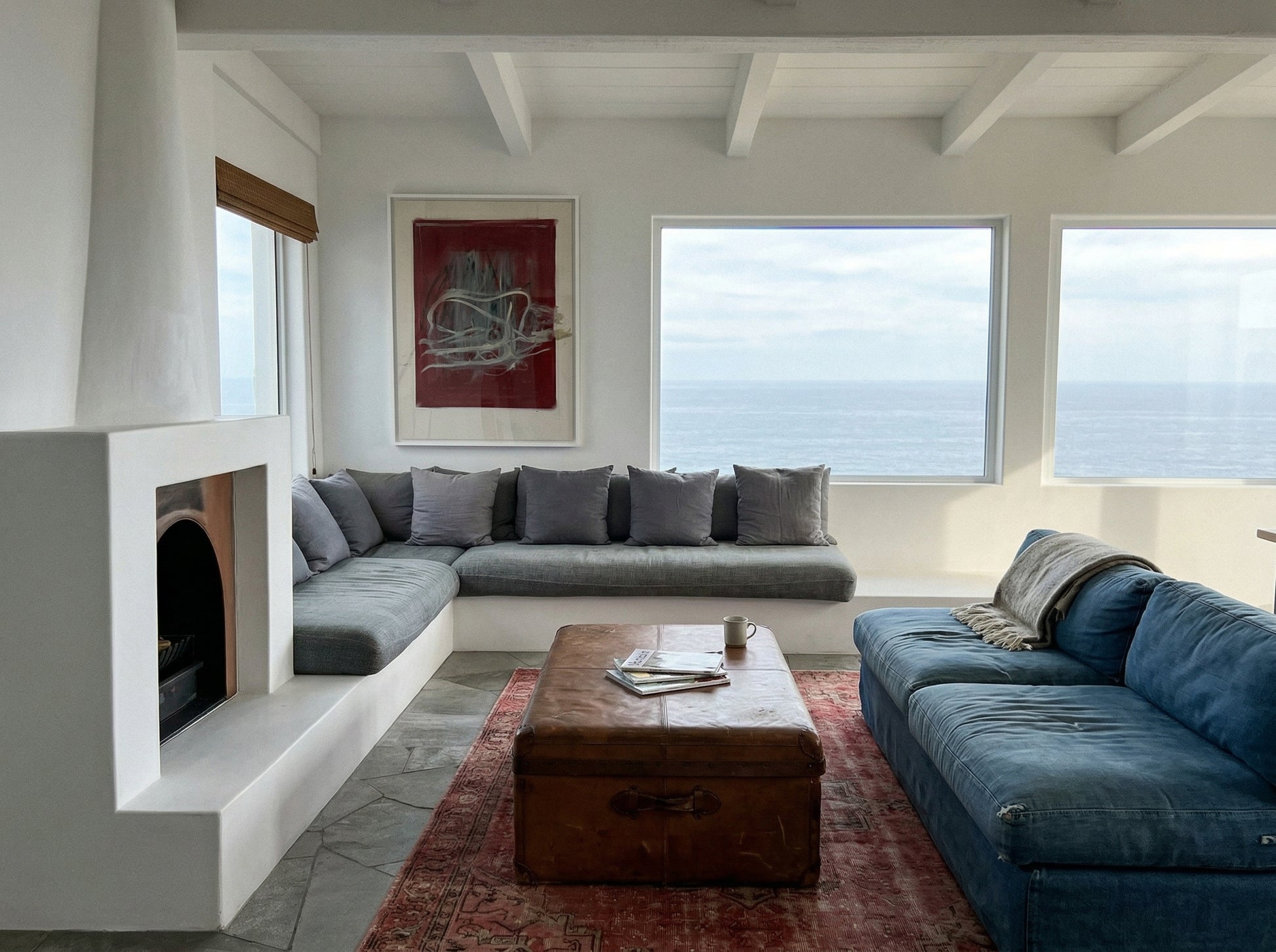 Modern living room with gray sectional sofa, blue sofa, and wooden coffee table. Tension – Bold Abstract Canvas Print | Large Luxury Wall Art | Brume Art
