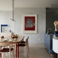 Modern kitchen with a dining area and a sculpture on a white counter. Tension – Bold Abstract Canvas Print | Large Luxury Wall Art | Brume Art