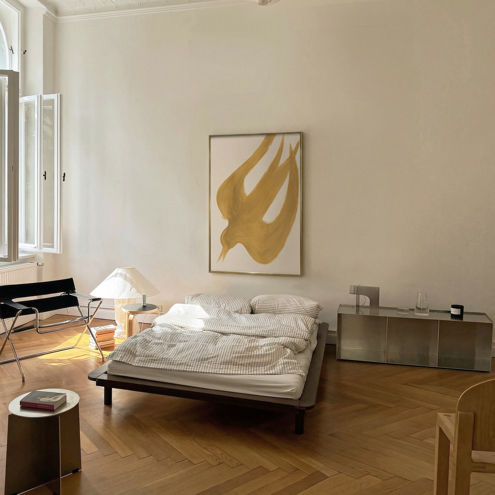 Modern bedroom with a bed, lamp, and abstract art on the wall. Golden Bird – Elegant Nature Canvas Print | Luxury Wall Art | Brume Art