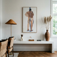 Modern interior with a desk, lamp, and artwork on a white wall. Man bathing – Portrait Canvas Wall Art | Large Luxury Print | Brume Art