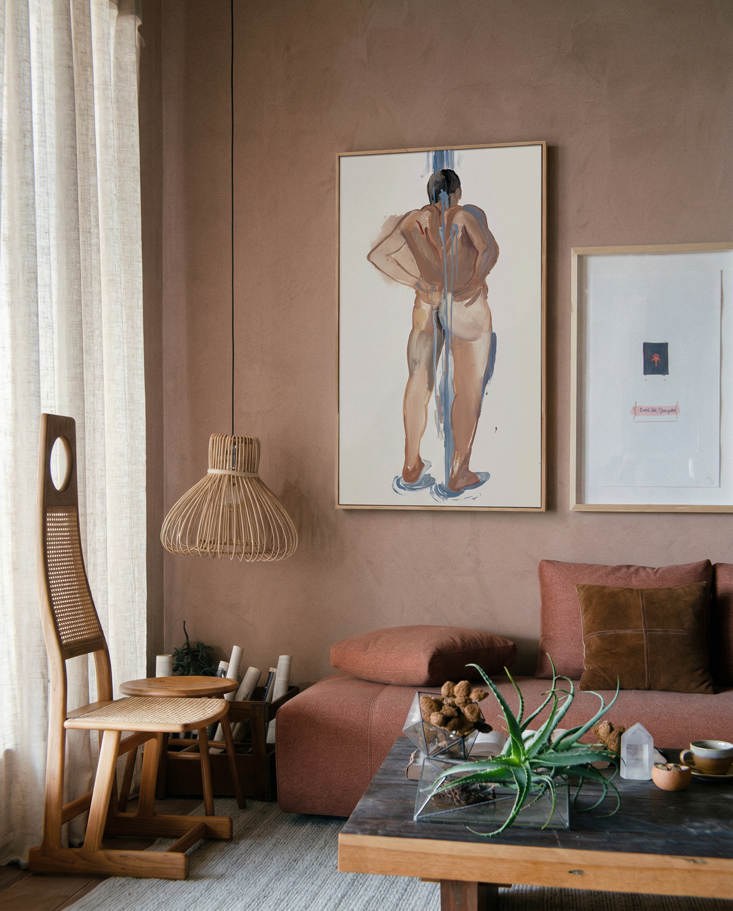 Living room with pink walls, a couch, a coffee table, and framed artwork. Man bathing – Portrait Canvas Wall Art | Large Luxury Print | Brume Art