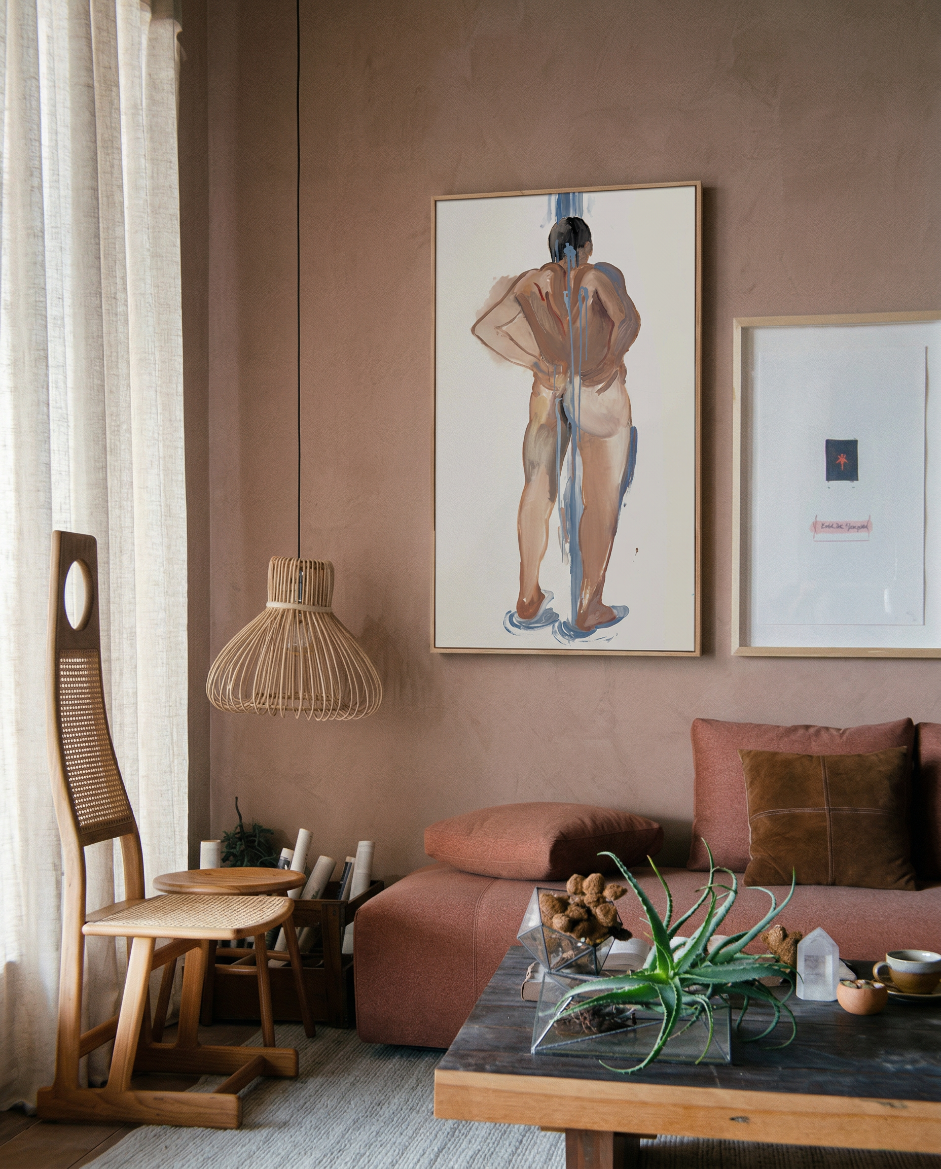 Living room with pink walls, a couch, a coffee table, and framed artwork. Man bathing – Portrait Canvas Wall Art | Large Luxury Print | Brume Art