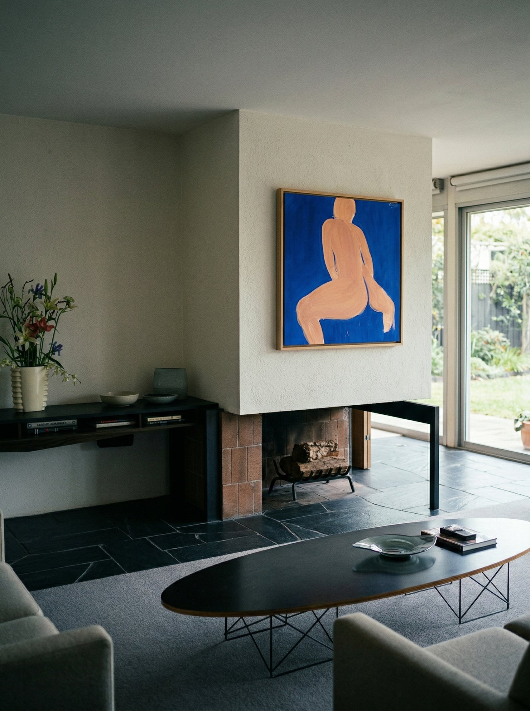 Modern living room with a painting of a nude figure on the wall. Figure in blue – Figurative Abstract Canvas | Premium Wall Art | Brume Art | Luxury Wall Decor | Large Canvas Wall Art | Oversized Wall Hanging-Brume art