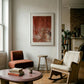 Living room with wooden coffee table, armchair, and rocking chair against a white wall with abstract art. Field red – Bold Abstract Canvas Print | Large Luxury Wall Art | Brume Art