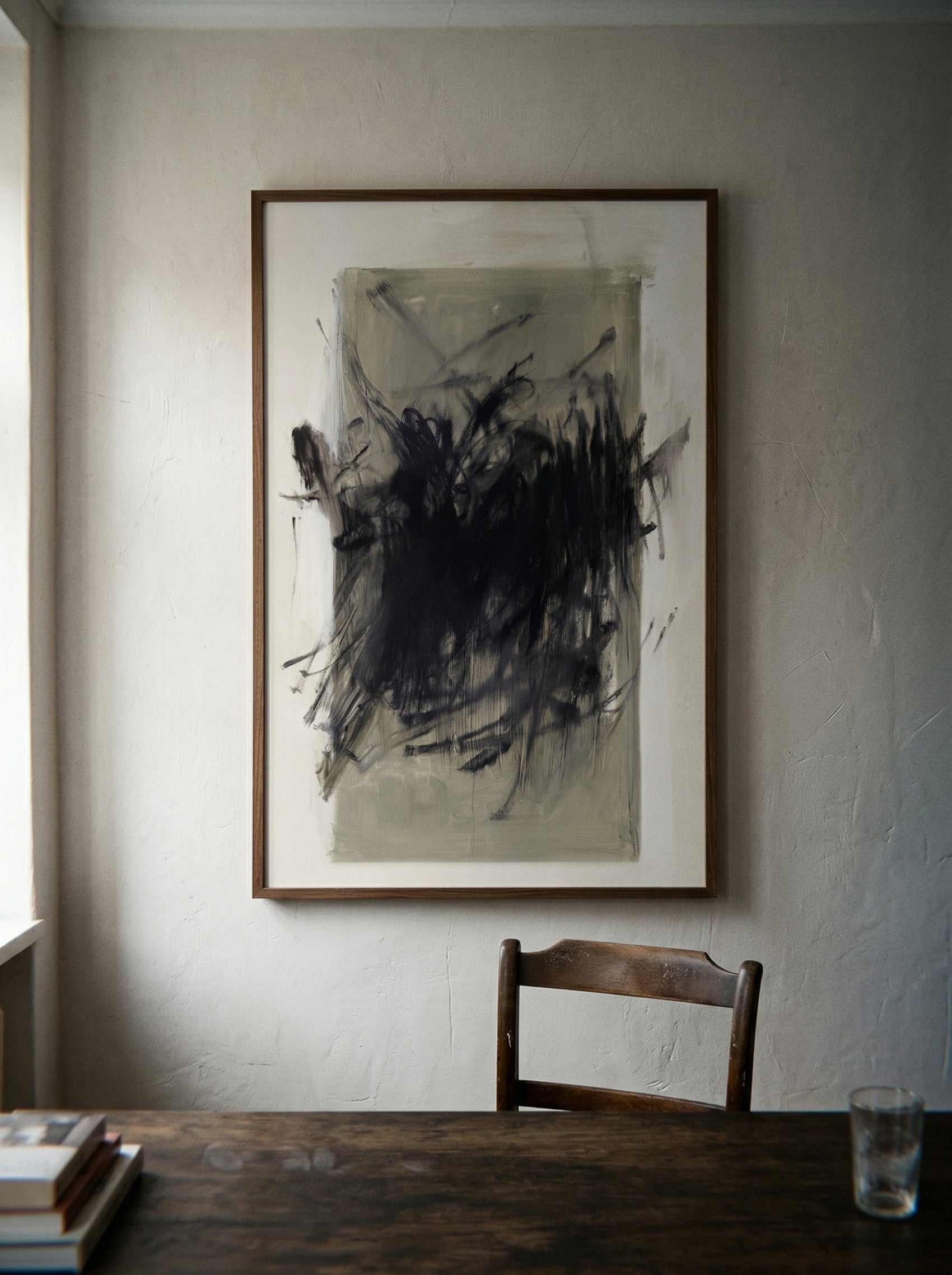 Abstract painting on a wall above a wooden table with a chair and glass. Tension 2 – Bold Abstract Canvas Print | Large Luxury Wall Art | Brume Art
