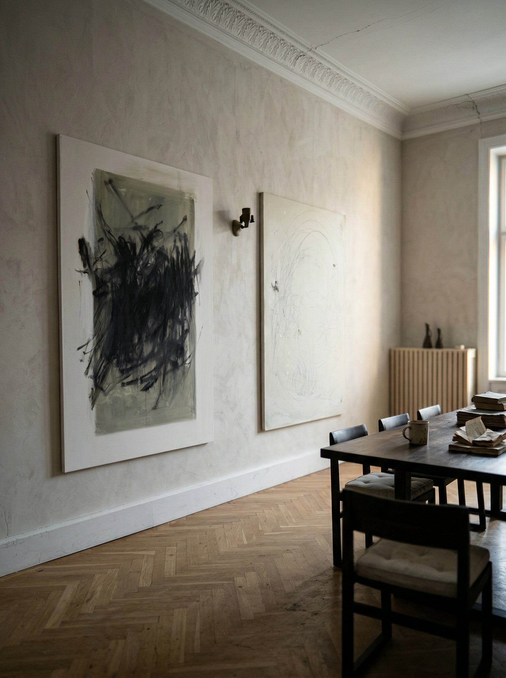 Dining room with abstract art on the wall and a table with chairs. Tension 2 – Bold Abstract Canvas Print | Large Luxury Wall Art | Brume Art