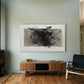 Modern living room with wooden floor, fireplace, and abstract art on the wall. Tension 2 – Bold Abstract Canvas Print | Large Luxury Wall Art | Brume Art