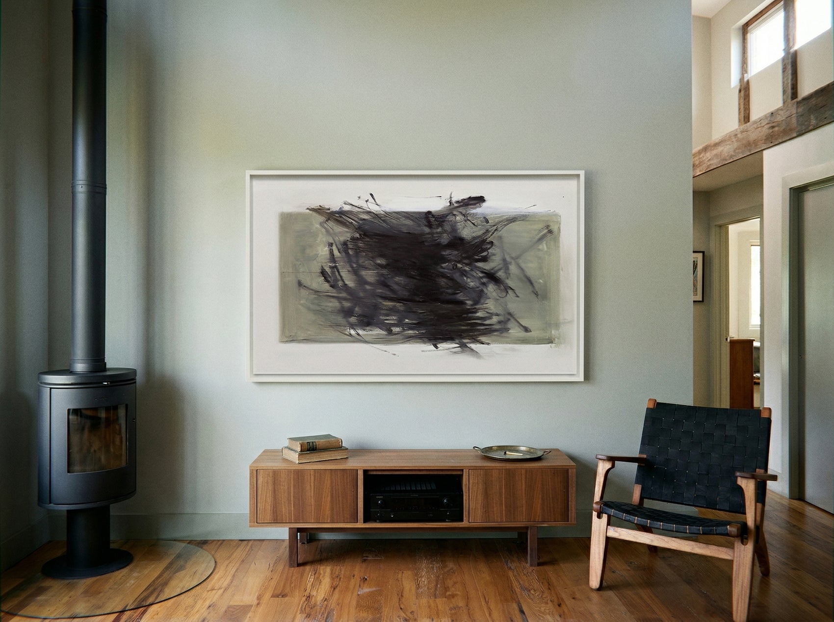 Modern living room with wooden floor, fireplace, and abstract art on the wall. Tension 2 – Bold Abstract Canvas Print | Large Luxury Wall Art | Brume Art