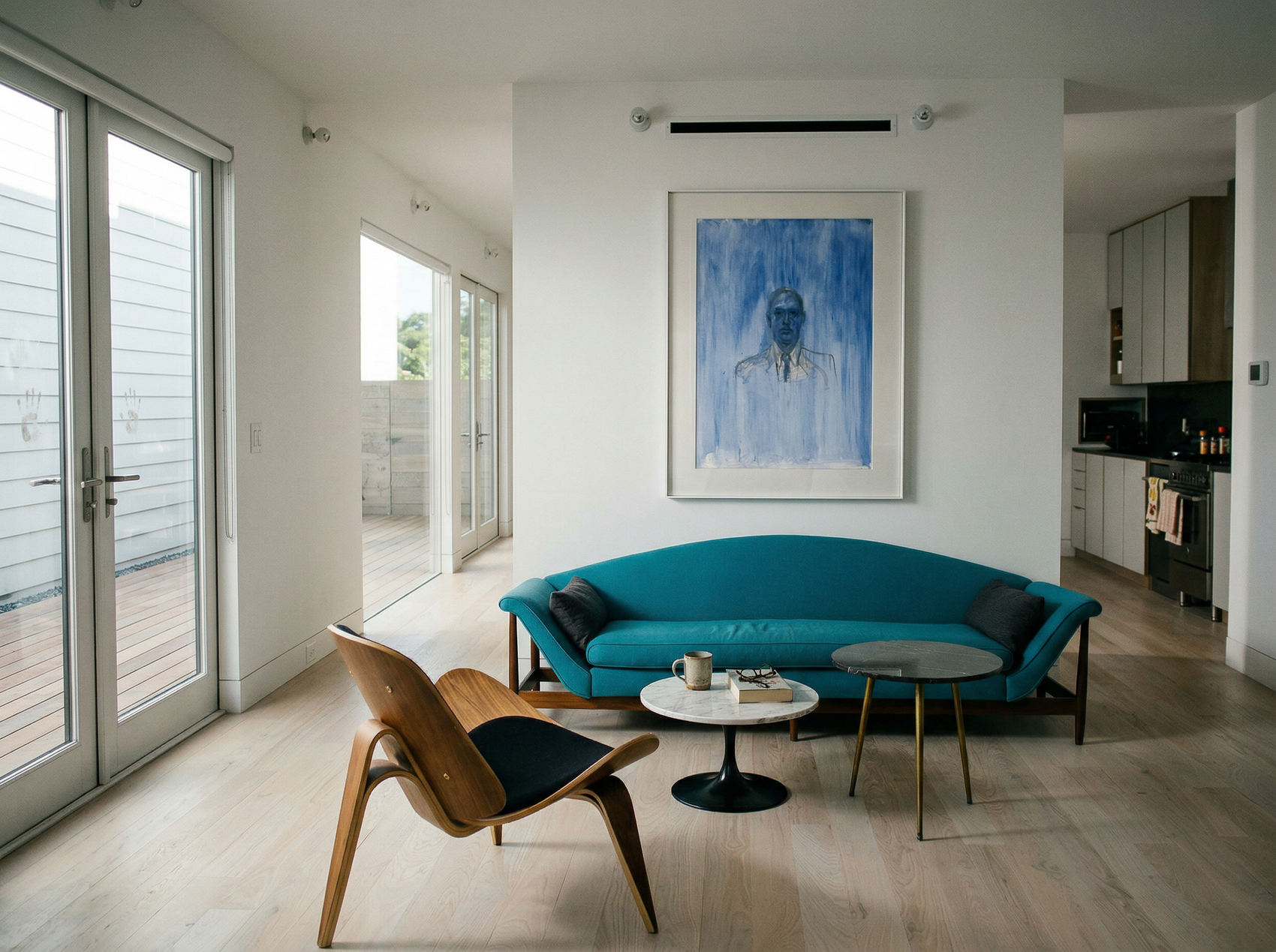 Modern living room with a blue sofa, wooden chair, and abstract painting on the wall. Portrait of a Man – Contemporary Portrait Canvas | Luxury Wall Art | Brume Art | Luxury Wall Decor | Large Canvas Wall Art | Oversized Wall Hanging-Brume art