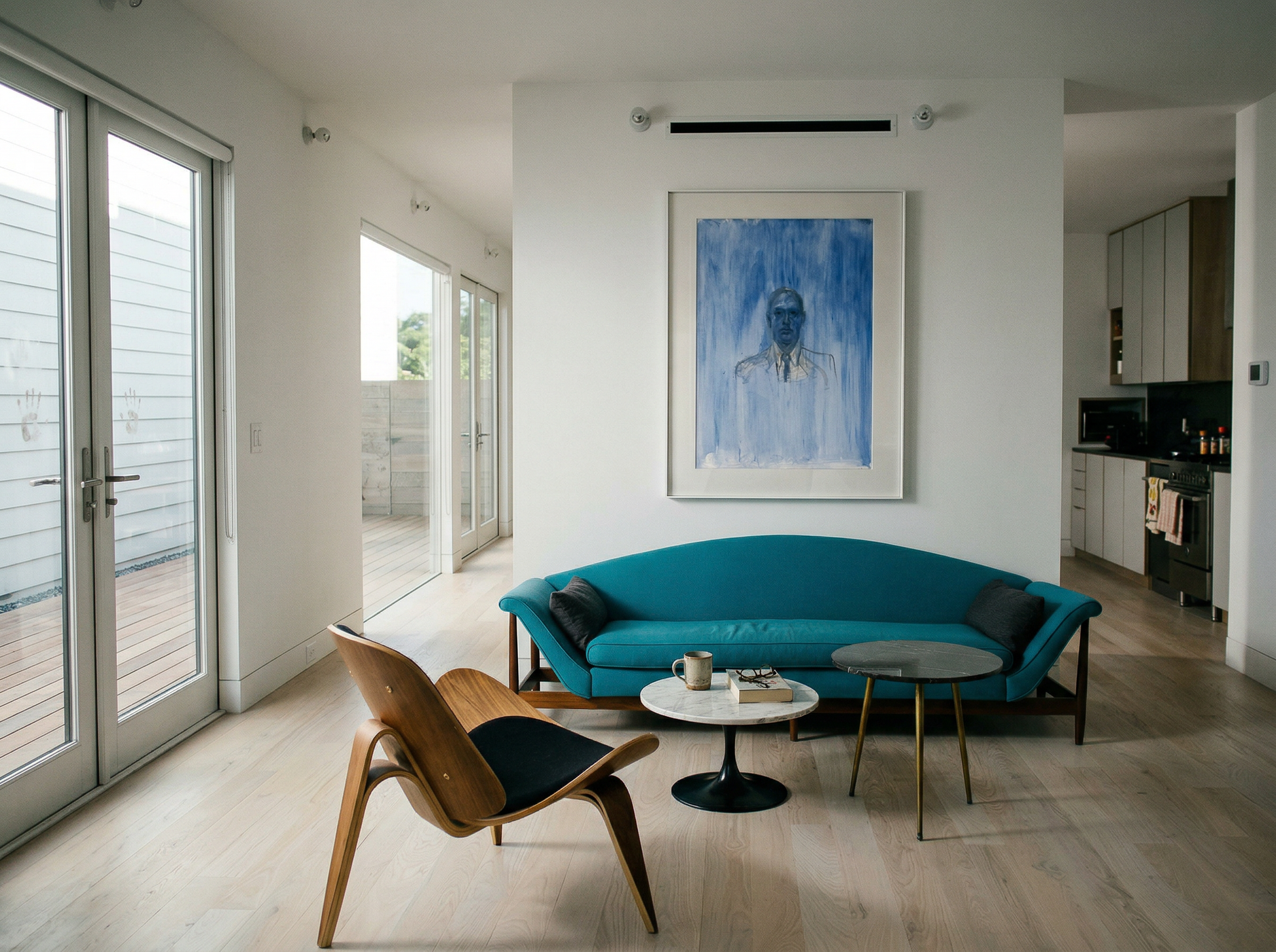 Modern living room with a blue sofa, wooden chair, and abstract painting on the wall. Portrait of a Man – Contemporary Portrait Canvas | Luxury Wall Art | Brume Art | Luxury Wall Decor | Large Canvas Wall Art | Oversized Wall Hanging-Brume art