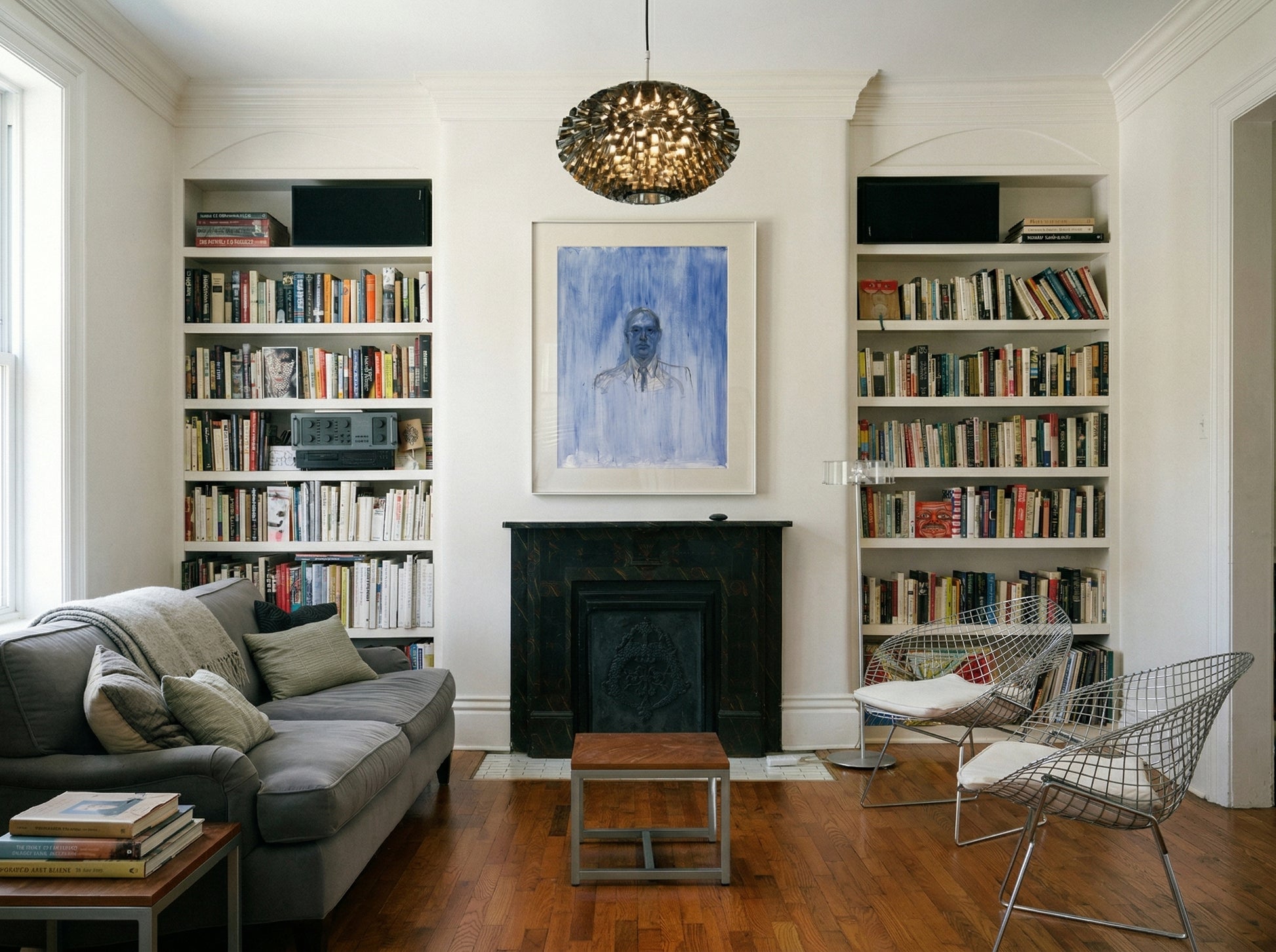 Living room with bookshelves, sofa, and fireplace Portrait of a Man – Contemporary Portrait Canvas | Luxury Wall Art | Brume Art | Luxury Wall Decor | Large Canvas Wall Art | Oversized Wall Hanging-Brume art