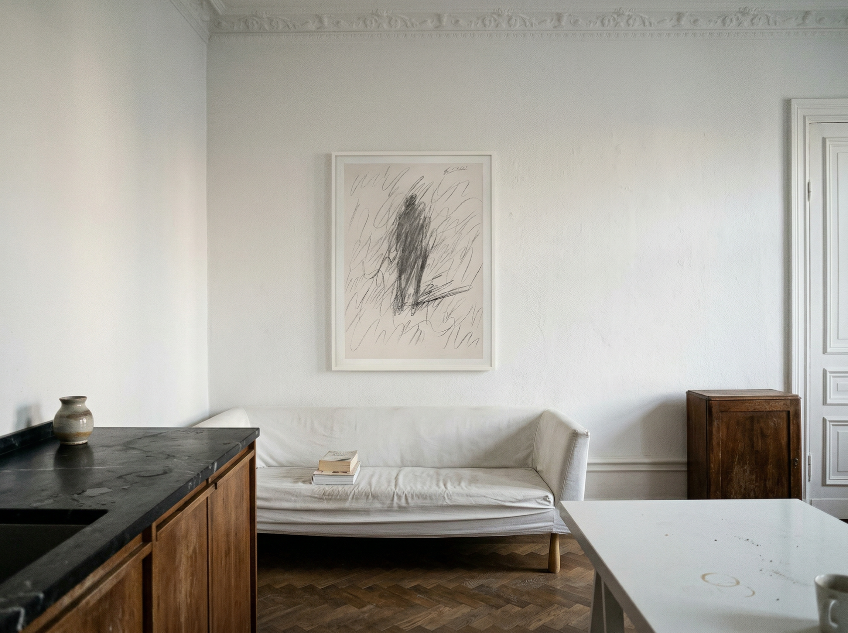 Modern kitchen with a bench, countertop, and wall art. Silhouette Sketch – Figurative Sketch Canvas Print | Luxury Wall Art | Brume Art