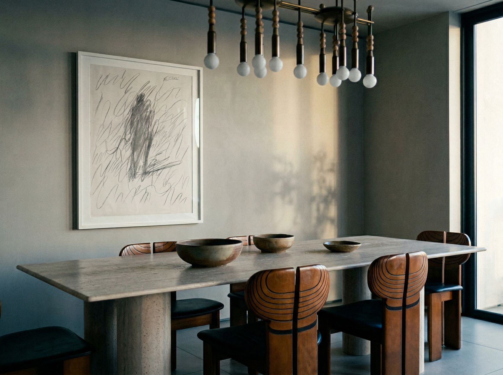 Dining room with a long table and chairs, abstract art on the wall, and a modern chandelier. Silhouette Sketch – Figurative Sketch Canvas Print | Luxury Wall Art | Brume Art