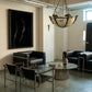 Modern living room with black leather furniture, a chandelier, and abstract art. Strike 2 – Bold Abstract Canvas Wall Art | Premium Luxury Print | Brume Art