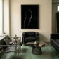 Modern living room with black leather furniture and a large abstract painting on the wall. Strike 2 – Bold Abstract Canvas Wall Art | Premium Luxury Print | Brume Art