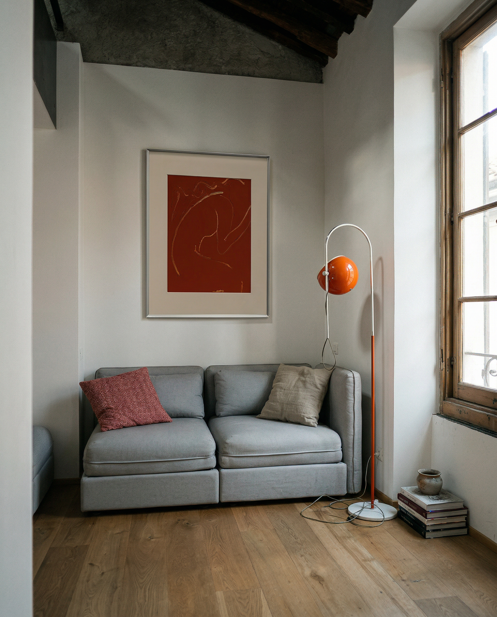 Gray sofa with decorative pillows in a room with a red abstract painting on the wall. Presence 2 – Figurative Abstract Canvas | Premium Wall Art | Brume Art