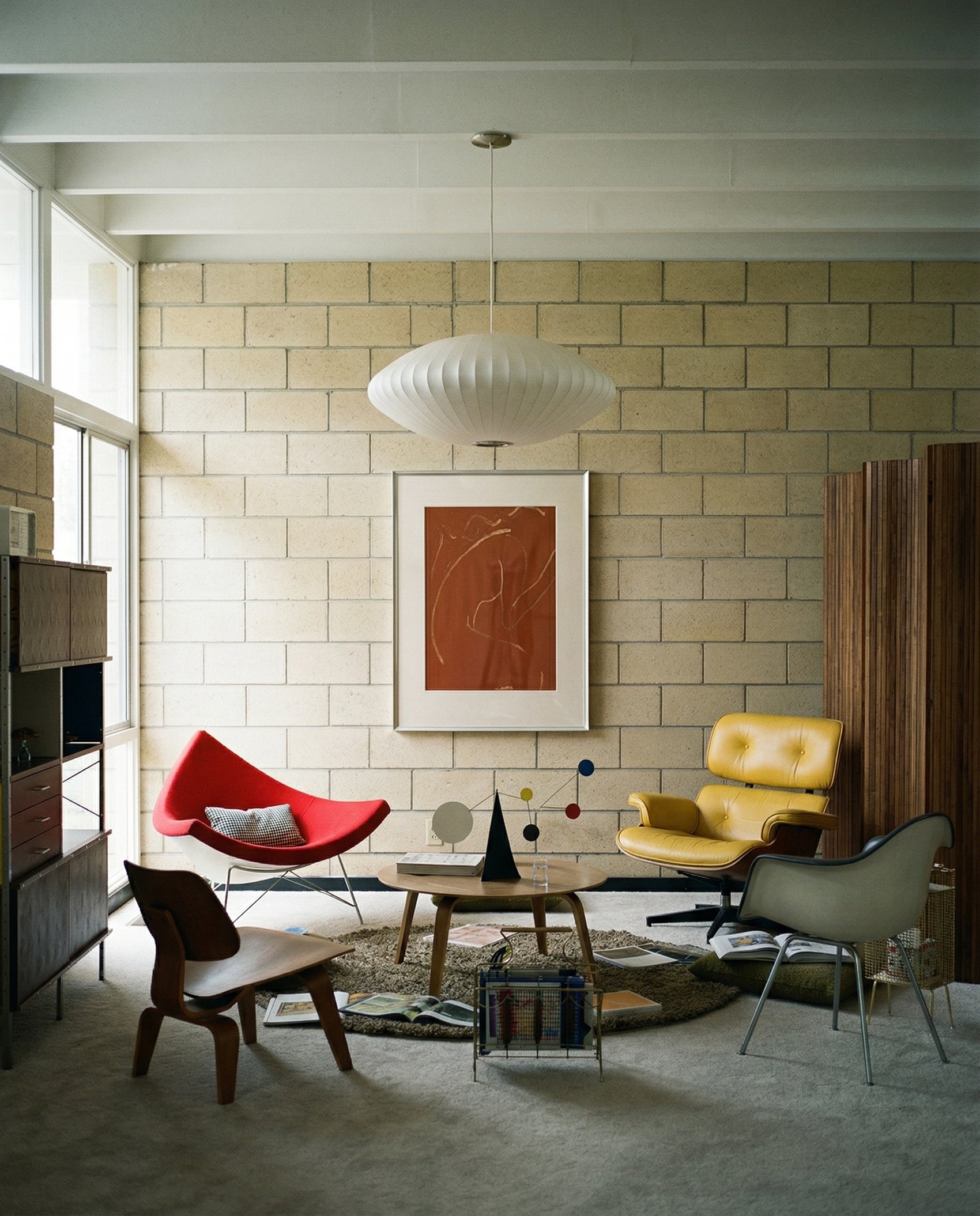 Modern living room with colorful chairs and a abstract painting on a tiled wall. Presence 2 – Figurative Abstract Canvas | Premium Wall Art | Brume Art