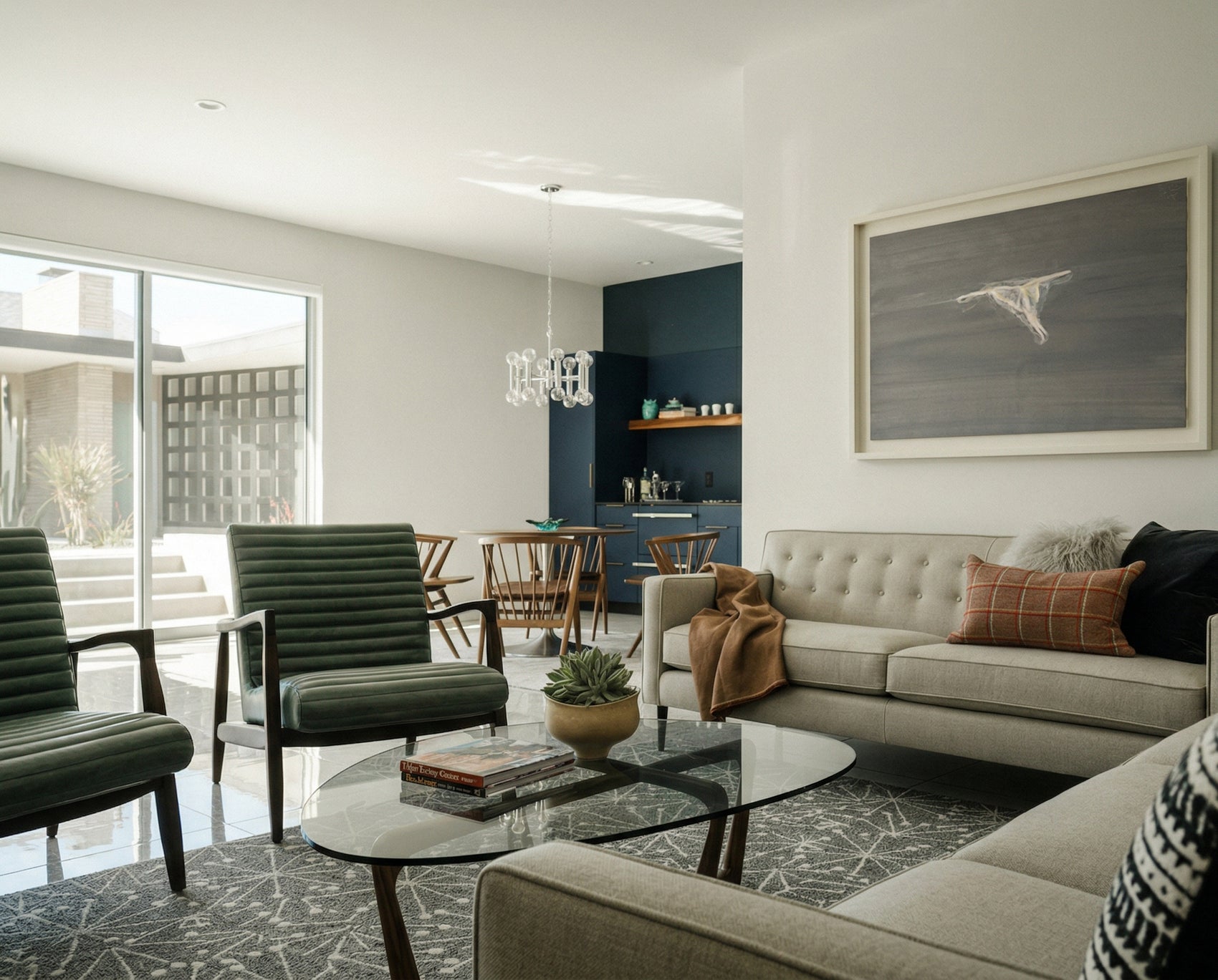 Modern living room with gray sofa, green chairs, and a glass coffee table. Thong - Minimalist Abstract Canvas Art | Large Luxury Wall Print | Brume Art