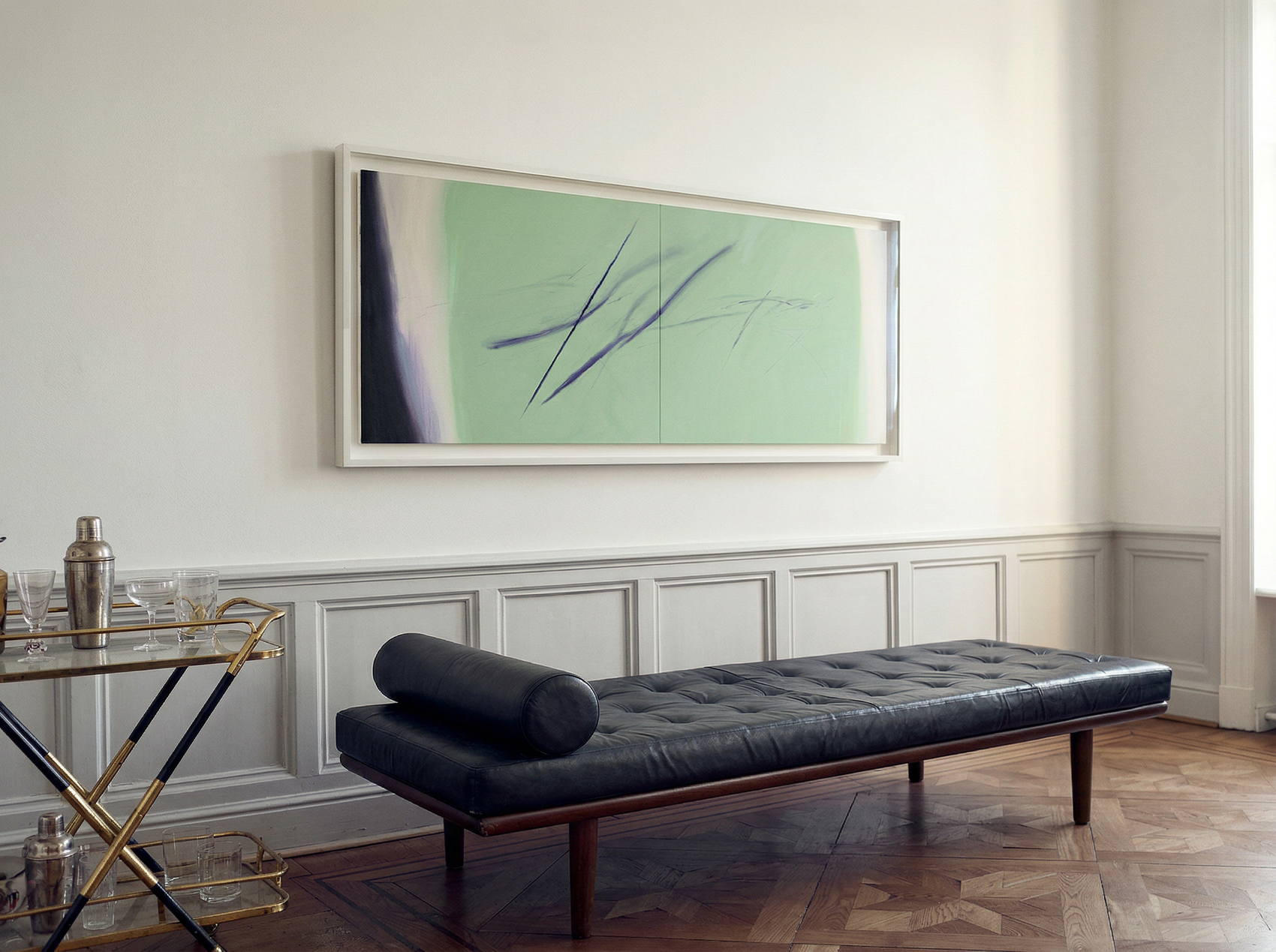 Modern living room with a black leather bench, glass table, and abstract painting on the wall. Big battle - Abstract Diptych Canvas Wall Art | Oversized Luxury Print | Brume Art | Luxury Wall Decor | Large Canvas Wall Art | Oversized Wall Hanging-Brume art