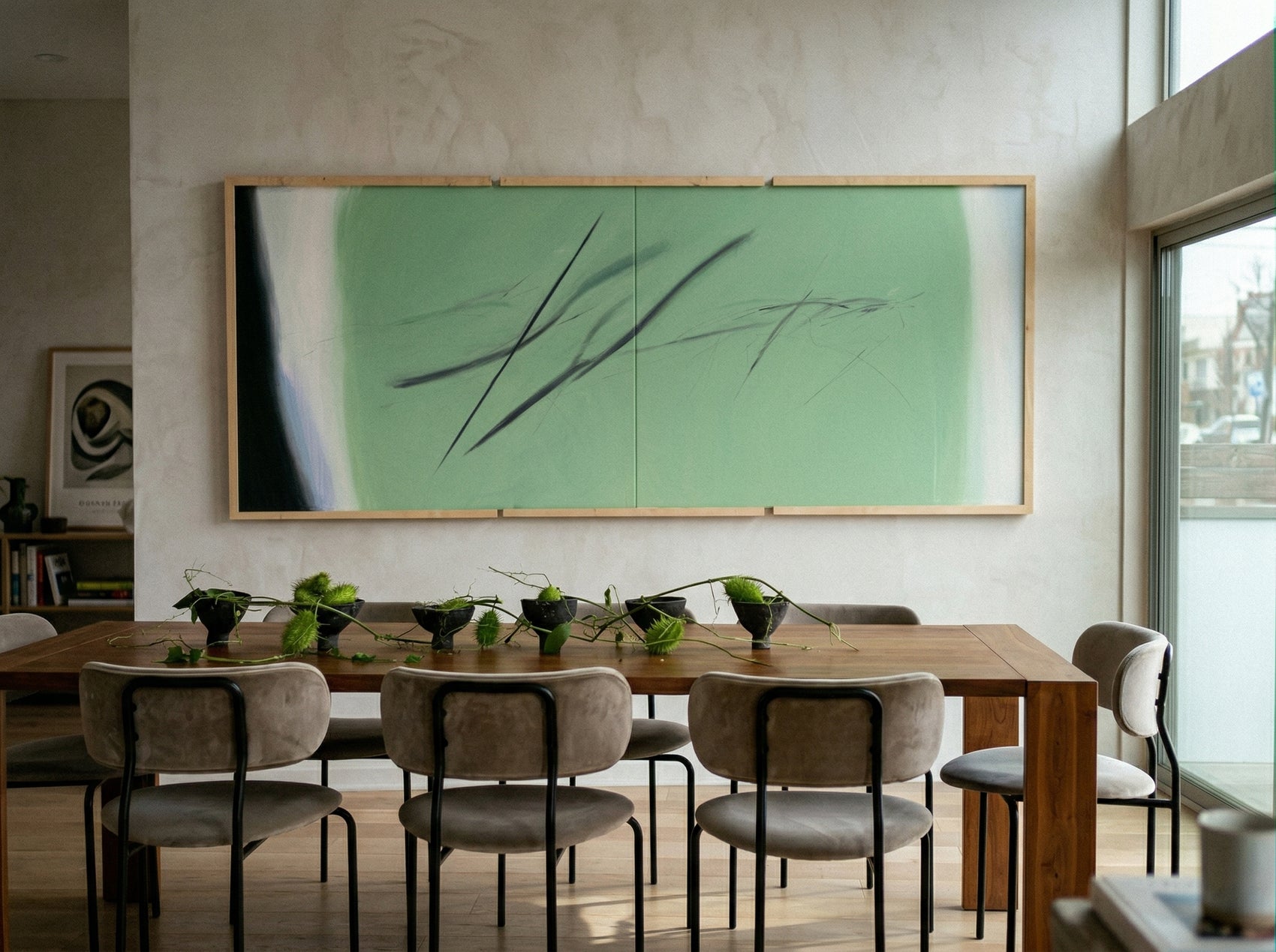 Dining room with a large abstract painting on the wall above a wooden table with chairs. Big battle - Abstract Diptych Canvas Wall Art | Oversized Luxury Print | Brume Art | Luxury Wall Decor | Large Canvas Wall Art | Oversized Wall Hanging-Brume art