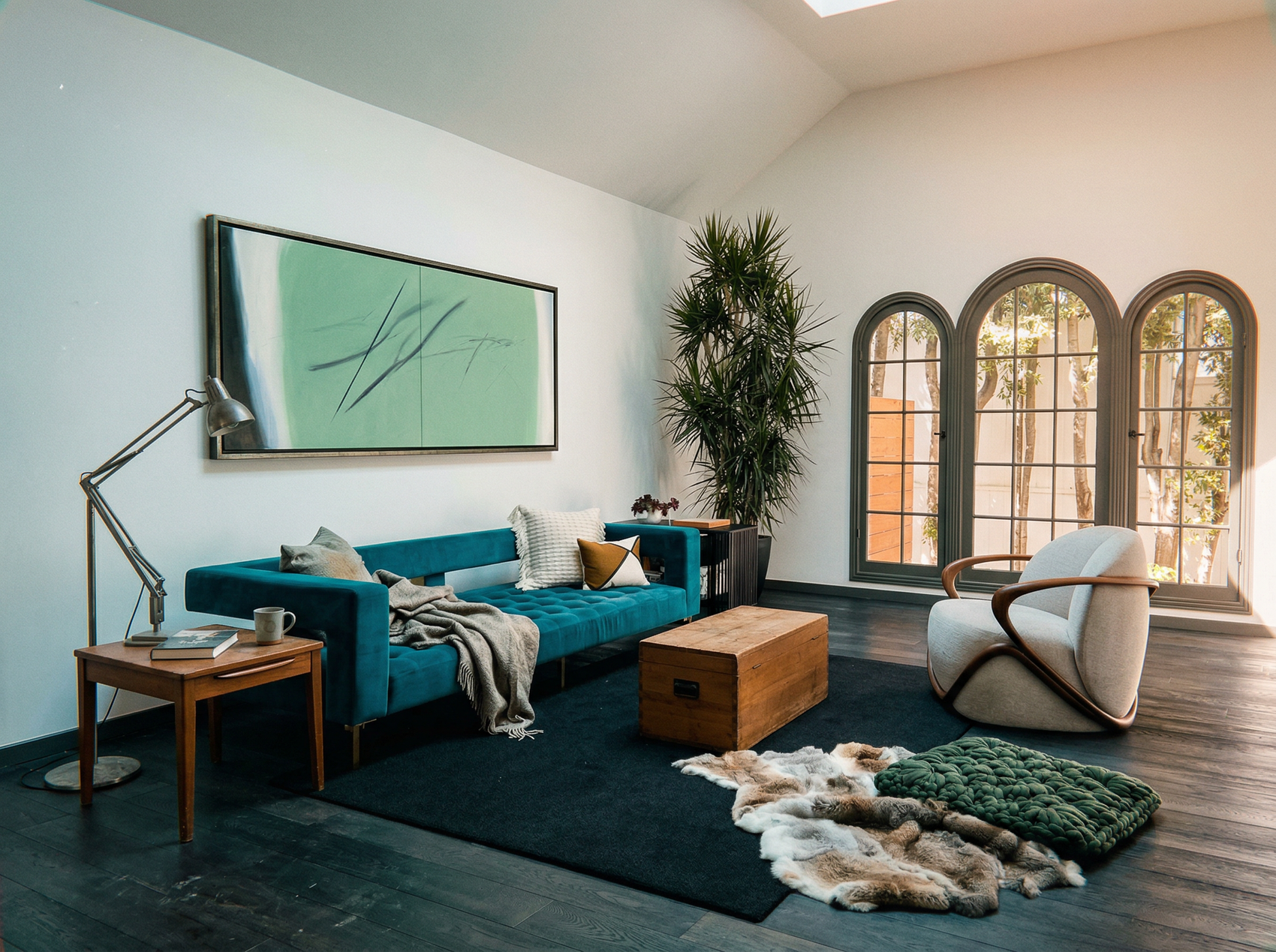 Modern living room with a blue sofa, armchair, and decorative items. Big battle - Abstract Diptych Canvas Wall Art | Oversized Luxury Print | Brume Art | Luxury Wall Decor | Large Canvas Wall Art | Oversized Wall Hanging-Brume art