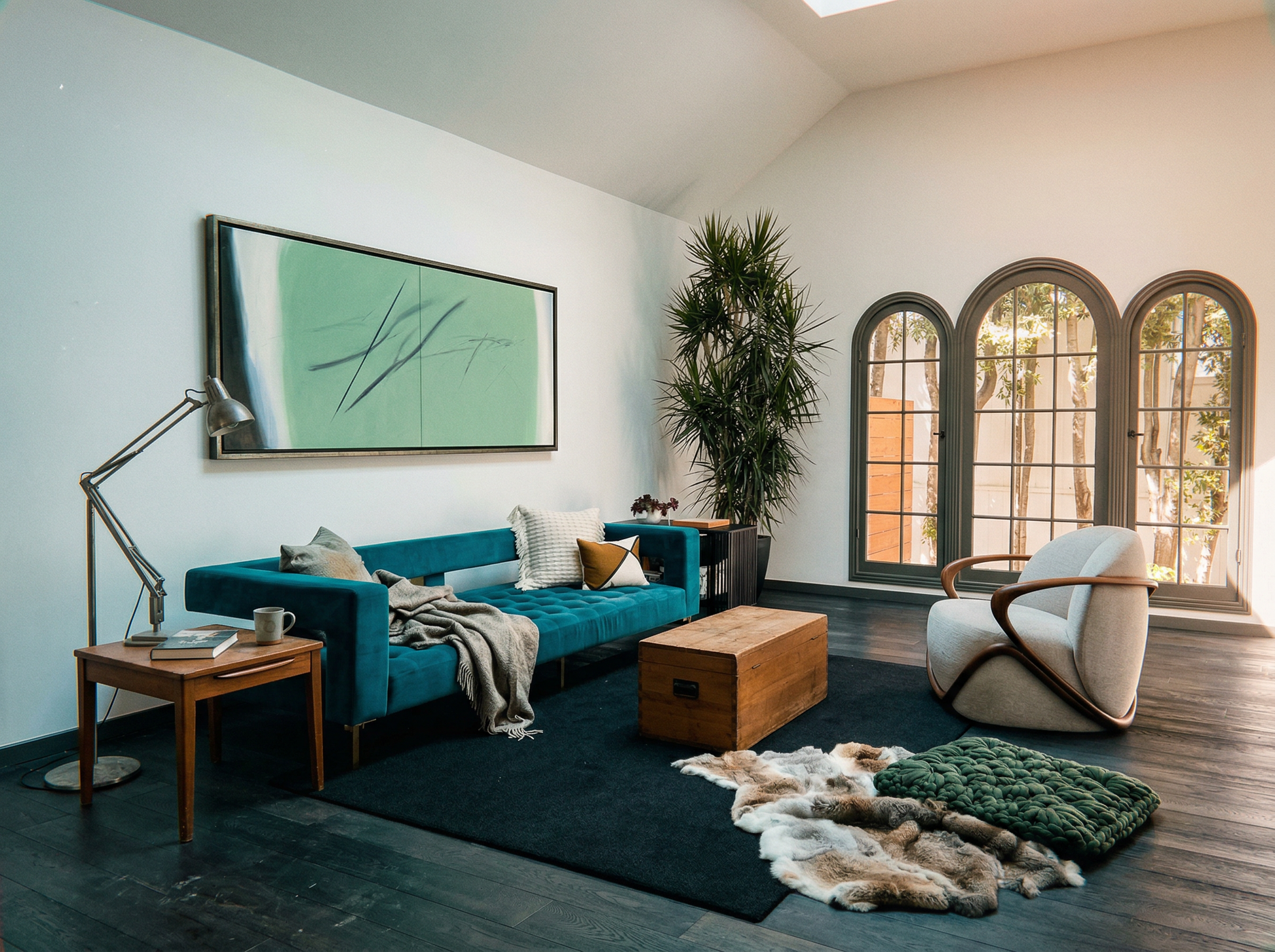 Modern living room with a blue sofa, armchair, and decorative items. Big battle - Abstract Diptych Canvas Wall Art | Oversized Luxury Print | Brume Art | Luxury Wall Decor | Large Canvas Wall Art | Oversized Wall Hanging-Brume art
