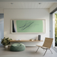 Modern living room with a large abstract painting on the wall, a chair, and a pouf. Big battle - Abstract Diptych Canvas Wall Art | Oversized Luxury Print | Brume Art | Luxury Wall Decor | Large Canvas Wall Art | Oversized Wall Hanging-Brume art