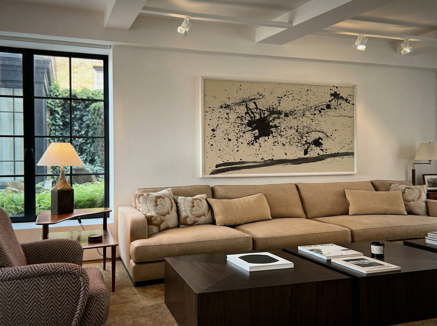 Modern living room with beige sectional sofa, armchair, and abstract art on the wall. Ink – Abstract Ink Canvas Wall Art | Large Premium Print | Brume Art | Luxury Wall Decor | Large Canvas Wall Art | Oversized Wall Hanging-Brume art