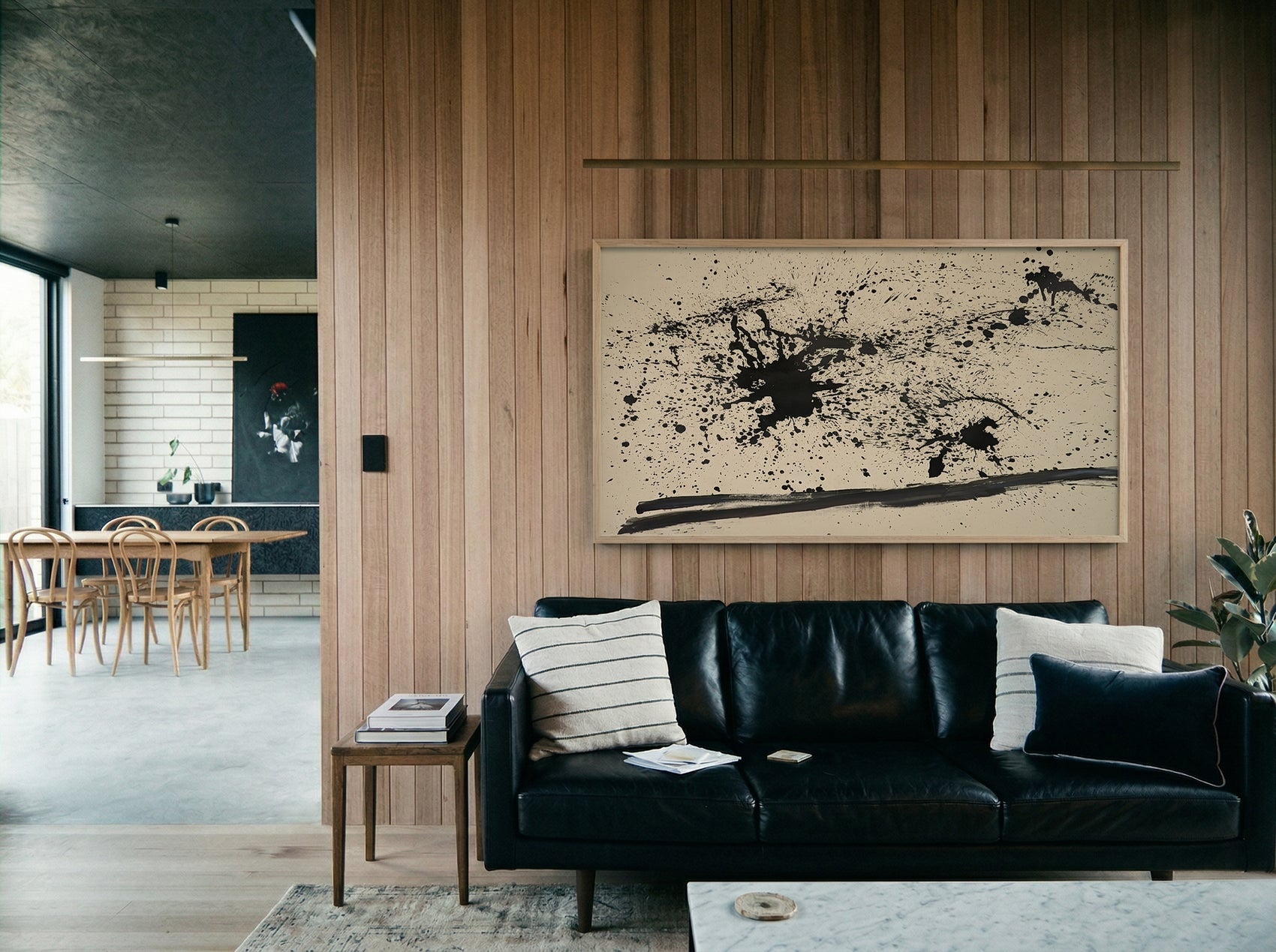 Modern living room with black leather sofa, abstract painting, and wooden wall. Ink – Abstract Ink Canvas Wall Art | Large Premium Print | Brume Art | Luxury Wall Decor | Large Canvas Wall Art | Oversized Wall Hanging-Brume art