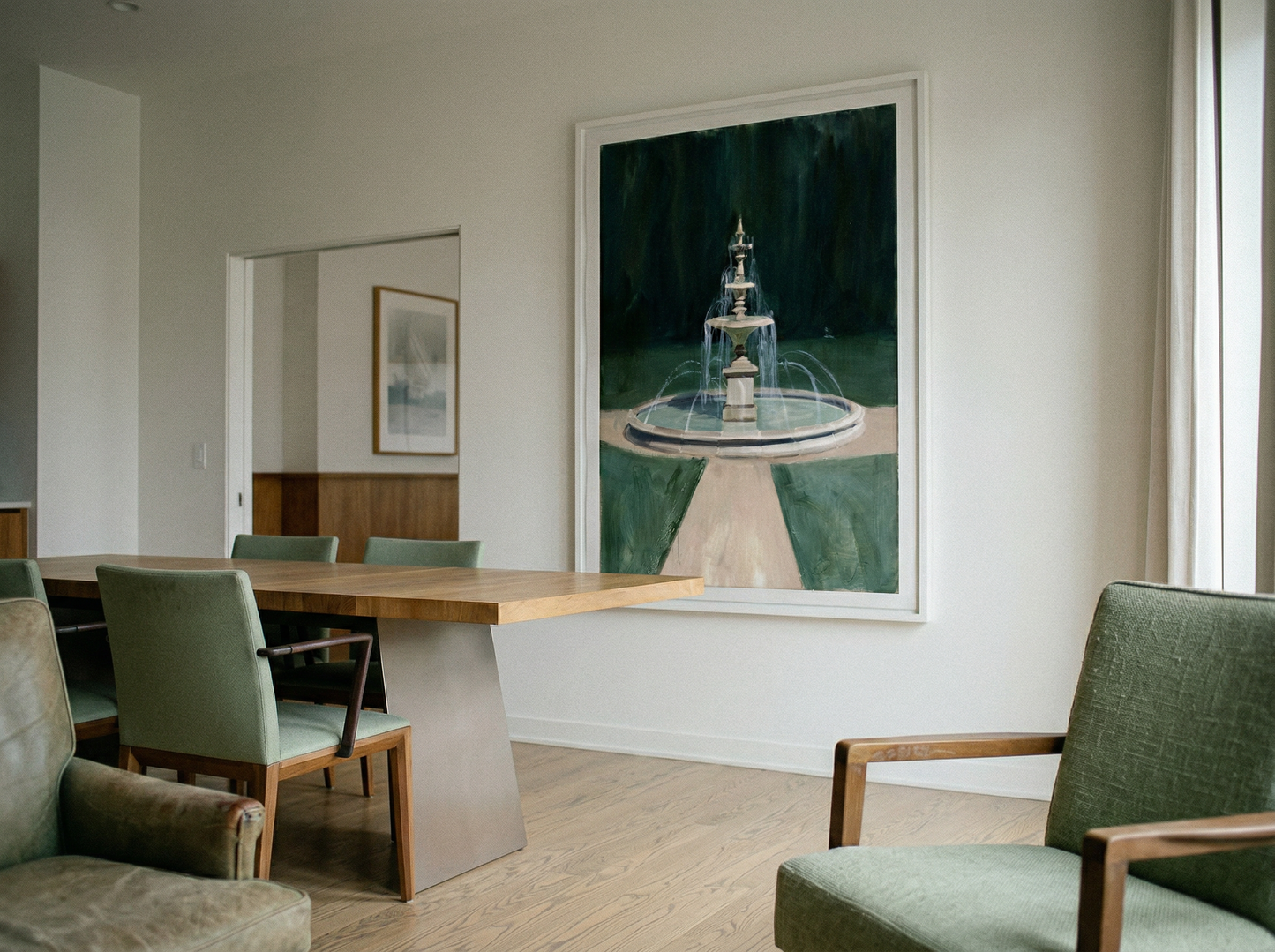 Modern interior with a dining table and chairs, featuring a large framed artwork of a lighthouse. The Fountain – Abstract Canvas Wall Art | Large Luxury Print | Brume Art| Luxury Wall Decor | Large Canvas Wall Art | Oversized Wall Hanging-Brume art