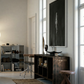 Modern interior with wooden desk, chair, and bookshelf in a well-lit room. In the black – Bold Abstract Canvas Wall Art | Large Luxury Print | Brume Art