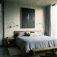 Modern bedroom with wooden bed, gray bedding, and abstract painting on the wall. In the black – Bold Abstract Canvas Wall Art | Large Luxury Print | Brume Art