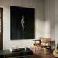 Modern interior with a large black and white painting, leather chair, and guitar on a textured floor. In the black – Bold Abstract Canvas Wall Art | Large Luxury Print | Brume Art