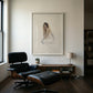 Modern interior with a black Eames chair, desk, and framed artwork on a white wall. Portrait of a lady – Portrait Canvas Wall Art | Large Luxury Print | Brume Art| Luxury Wall Decor | Large Canvas Wall Art | Oversized Wall Hanging-Brume art