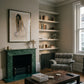 Living room with green marble fireplace, patterned armchair, and bookshelf. Portrait of a lady – Portrait Canvas Wall Art | Large Luxury Print | Brume Art| Luxury Wall Decor | Large Canvas Wall Art | Oversized Wall Hanging-Brume art