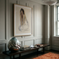 Room interior with a framed artwork on the wall, a bench, and decorative items. Portrait of a lady – Portrait Canvas Wall Art | Large Luxury Print | Brume Art| Luxury Wall Decor | Large Canvas Wall Art | Oversized Wall Hanging-Brume art