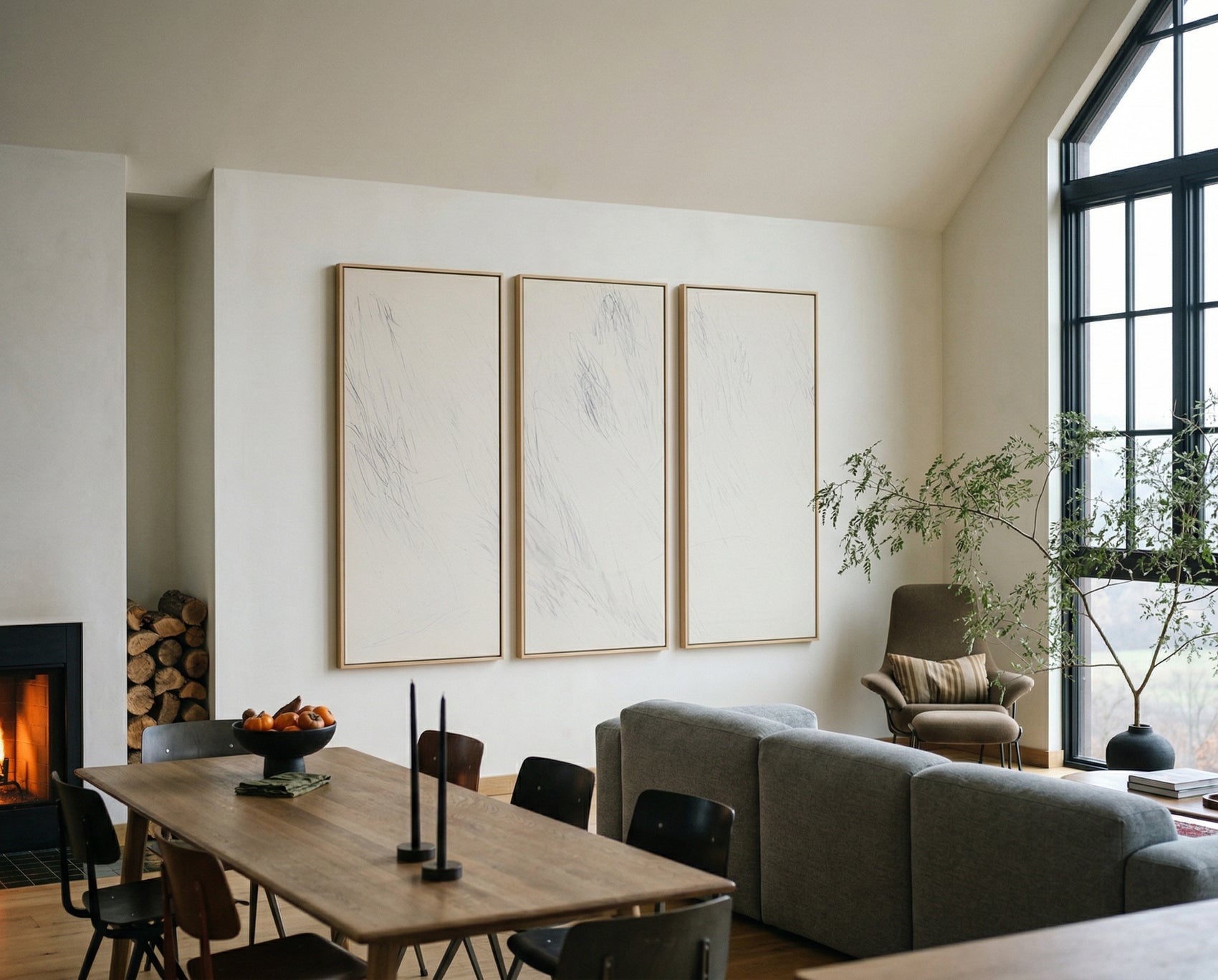 Modern living room with a fireplace, dining table, and gray sofa. Black lines 2 – Bold Abstract Canvas Wall Art | Premium Luxury Print | Brume Art| Luxury Wall Decor | Large Canvas Wall Art | Oversized Wall Hanging-Brume art