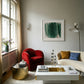 Modern living room with a red armchair, white sofa, and abstract art on the wall. Field green 3 – Textured Abstract Canvas Art | Premium Luxury Wall Decor | Brume Art