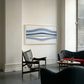 Modern living room with abstract artwork on the wall, black chairs, and a coffee table. Blue Stripes – Abstract Diptych Canvas Art | Large Luxury Wall Print | Brume Art
