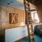 Room with wooden walls, a ladder, and a couch. Form - Bold Abstract Canvas Print | Large Luxury Wall Art | Brume Art | Luxury Wall Decor | Large Canvas Wall Art | Oversized Wall Hanging-Brume art